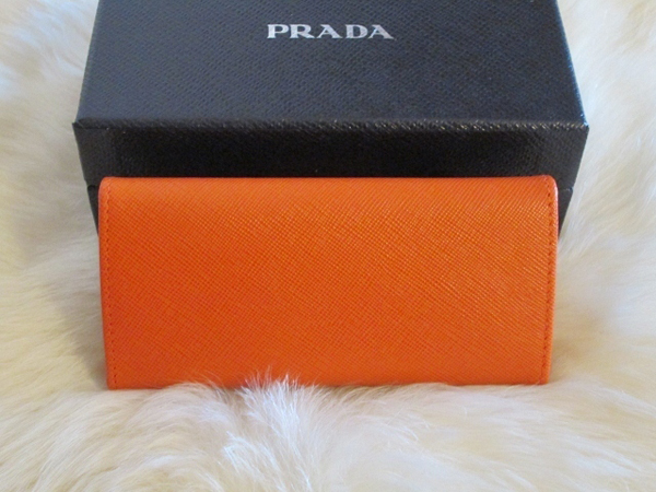 PRADA プラダキーケーススーパーコピー 大リボン付 レザーキーケース６連 オレンジ サフィアーノ 1M0223